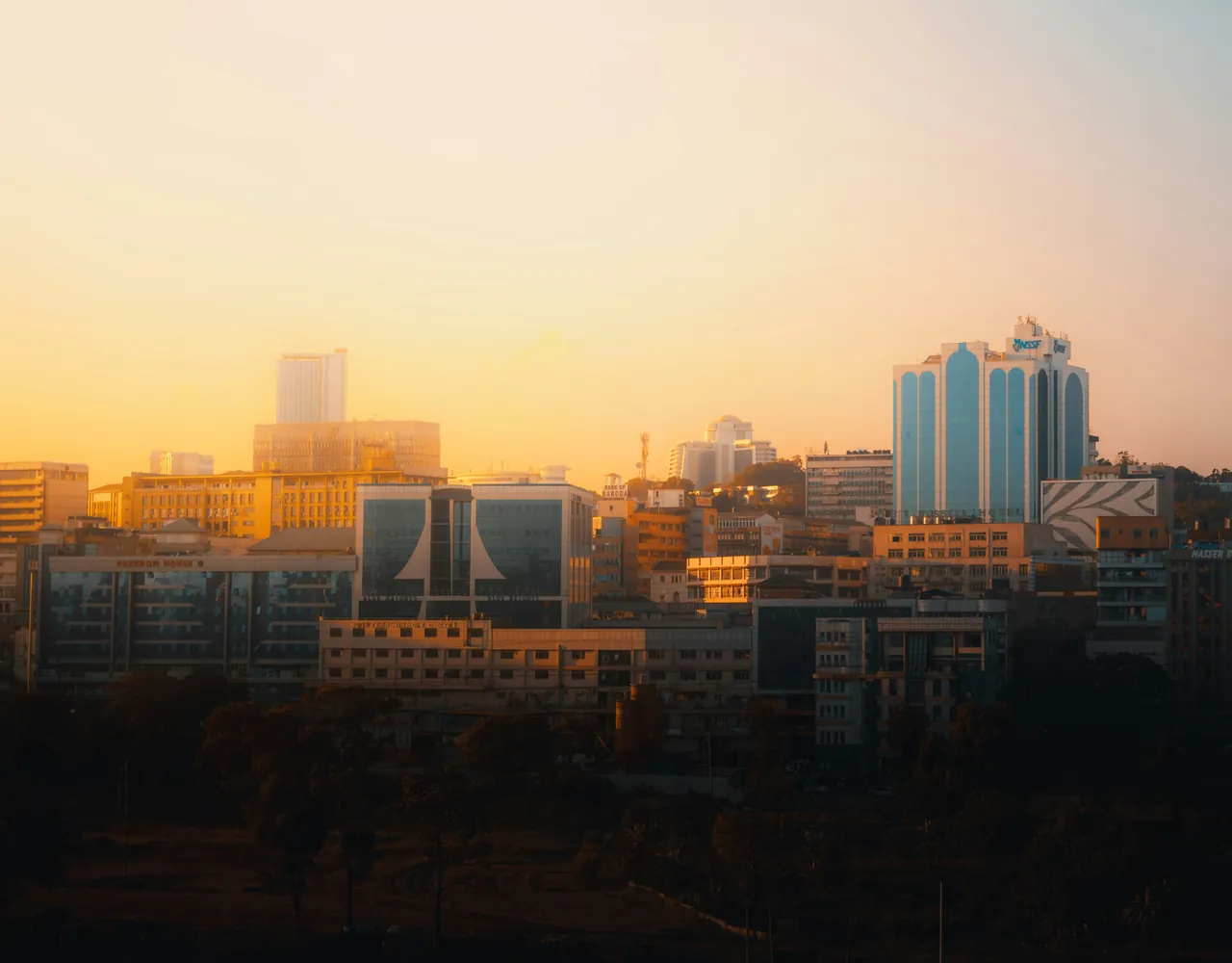 The Kampala skyline glowing in warm sunset light